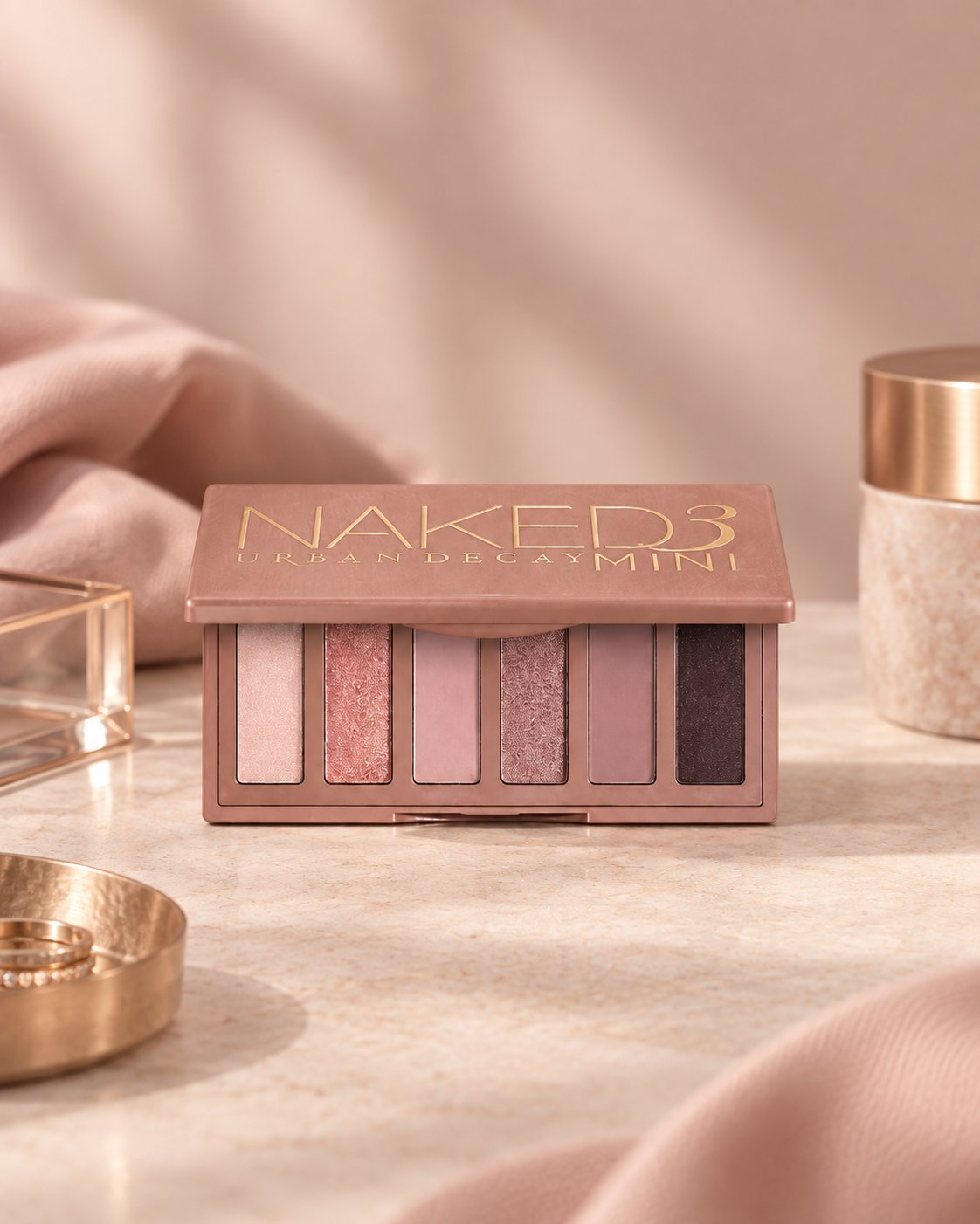 Urban Decay Naked3 Mini Eyeshadow Palette with rosy neutral shades for a soft glam makeup look.